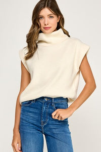beige sleeveless turtleneck sweater